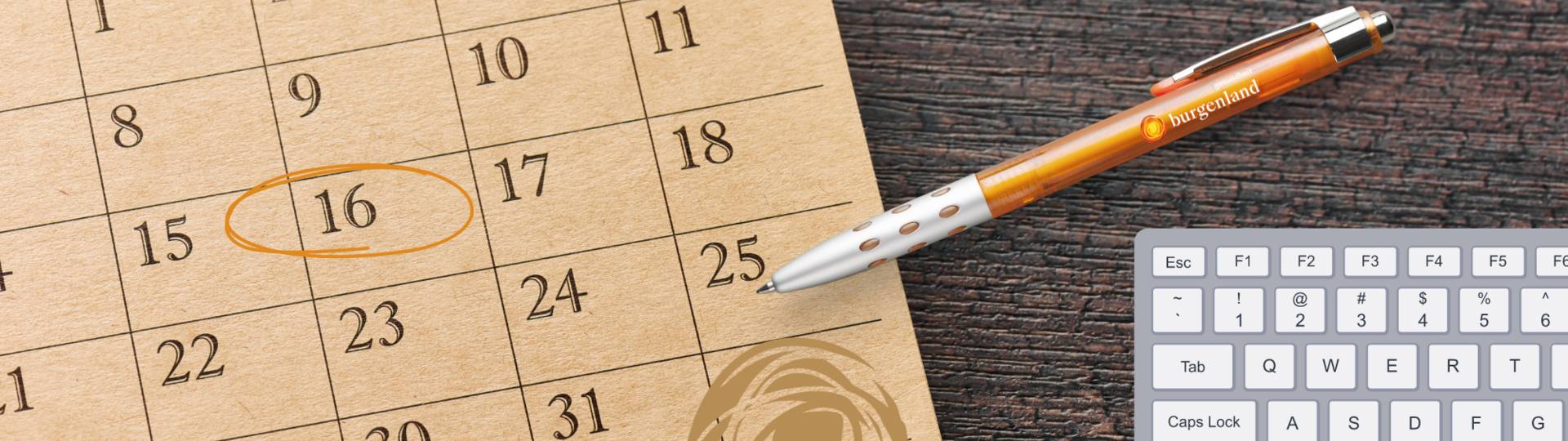 Terminvergabe: Kalender mit Kugelschreiber
